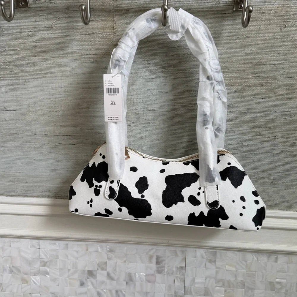 NWT new Anthropologie melie bianco east west shoulder bag cow print black white